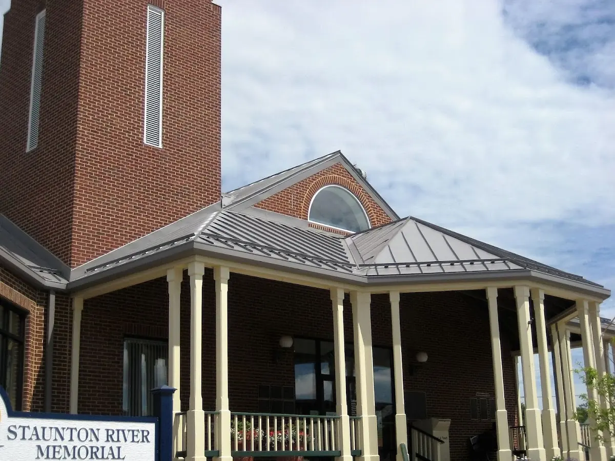 Skilled roofing craftsmen working on a residential roof in Rutgers